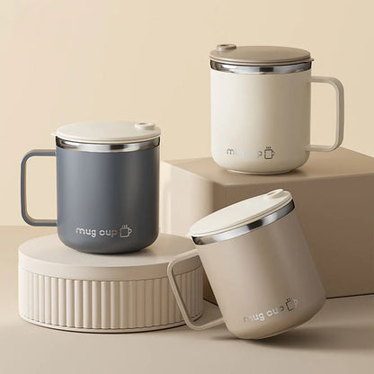 Three insulated mugs in gray, white, and beige on a beige background