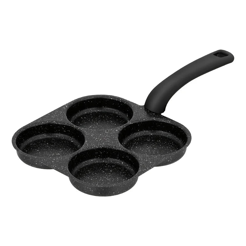 Black cast iron four-socket frying pan on a white background