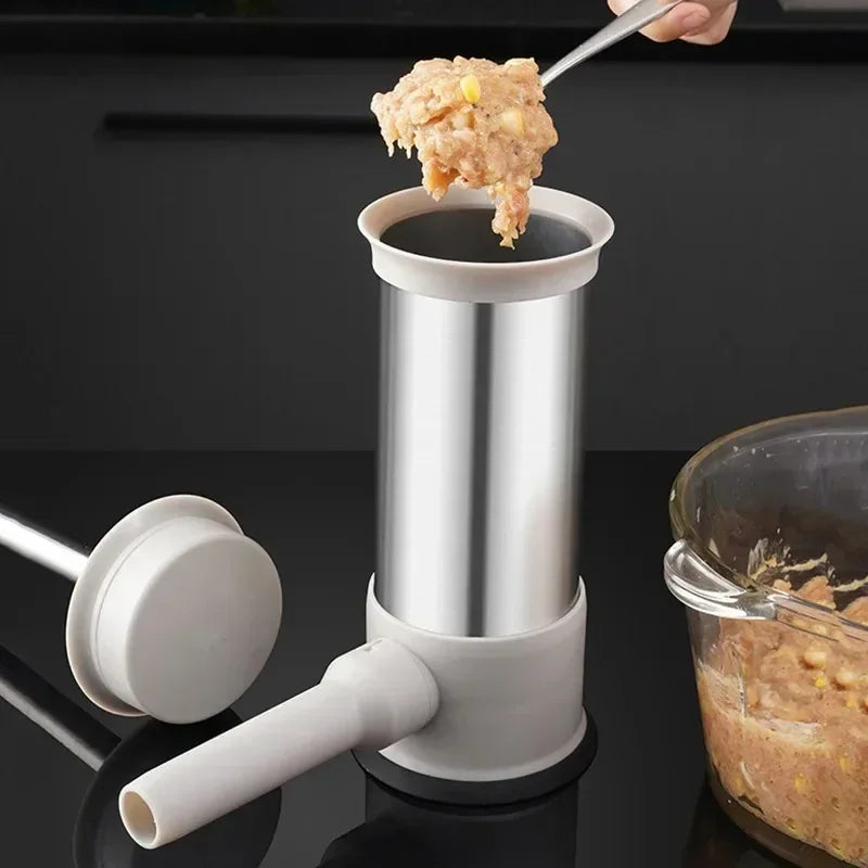 Manual meat grinder with food being ground on a black background