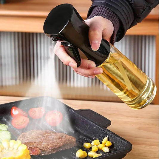 Person pouring oil from a bottle onto a grill with food on a wooden surface.