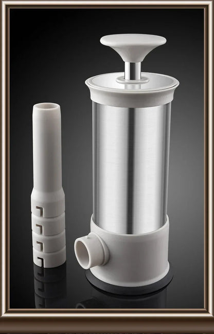White and silver kitchen press on a reflective black surface