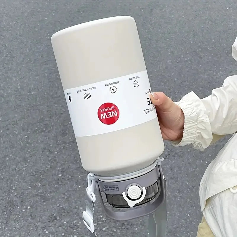 Person holding a white camping stove with a label on a gray background
